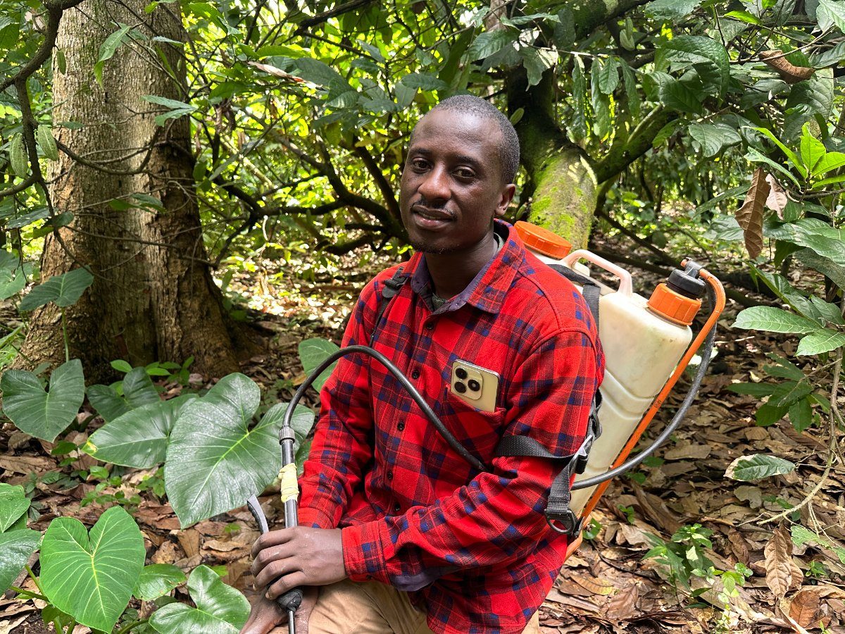 A cocoa farmer in Araromi-Ekiti with his spraying equipment